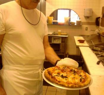 Pizza made at Osteria Alfredo Photo