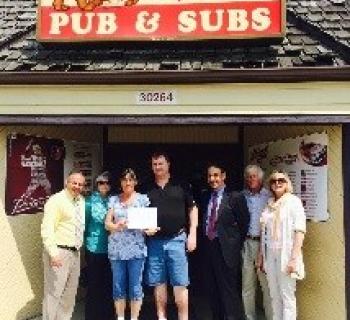 Spike's owners receiving small business award Photo