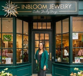 Founder Stacey Krantz at InBloom Jewelry's brick and mortar location on East Patrick Street.  Photo