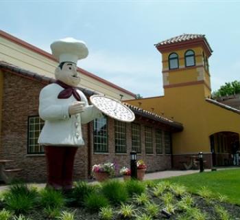The iconic pizza man has been standing tall since 1977. Photo