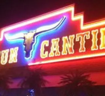 Cancun Cantina sign glows at night. Photo