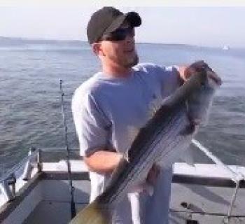 Man holding up a quality fish Photo