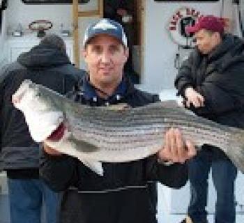 Charles Sisson Charter fisherman with large catch Photo