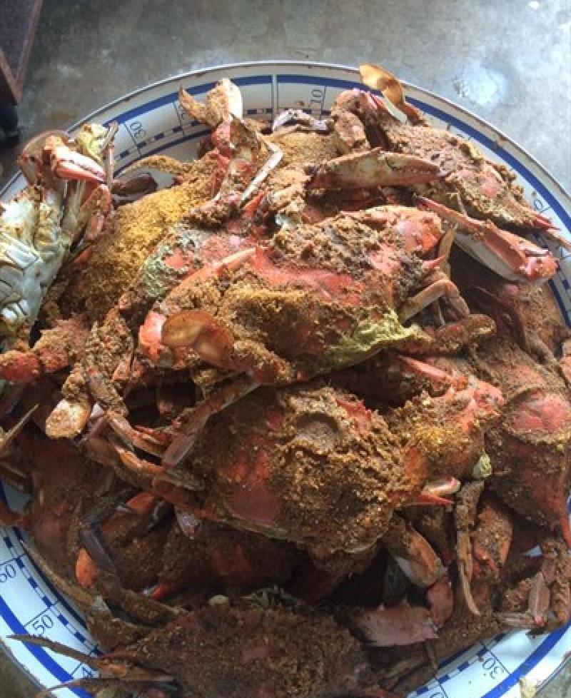Enjoying crabs ast Strongs Bay Seafood Inc Photo