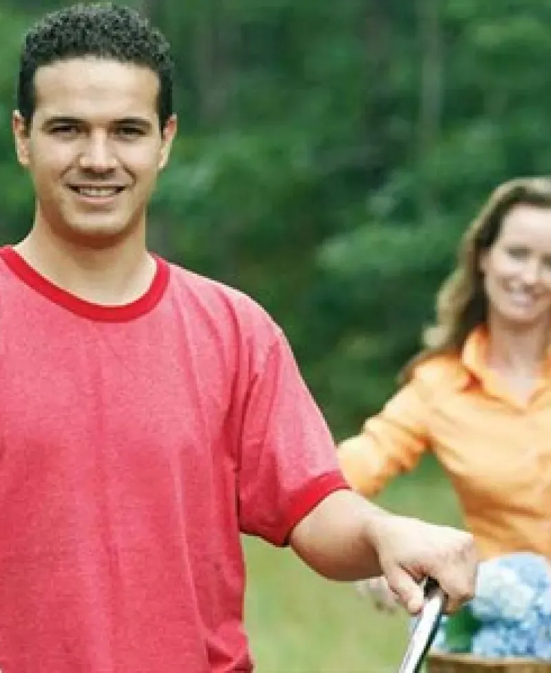 A couple riding bikes together Photo
