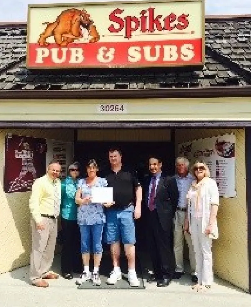Spike's owners receiving small business award Photo