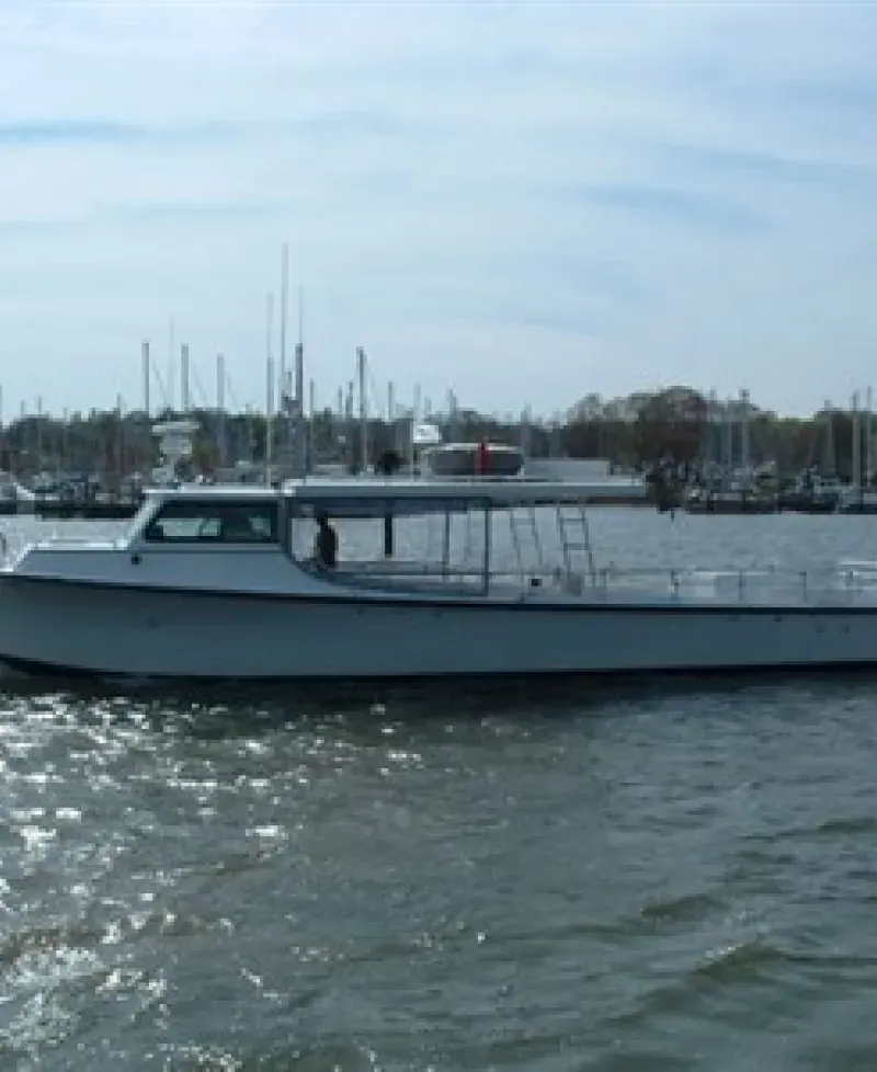 The Charter Boat "Wound Tight" works the mid-bay Photo