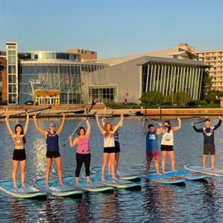 People on paddleboards in the Inner Harbor Photo
