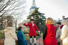 Watermark tour guide with group at the Maryland State House. Photo