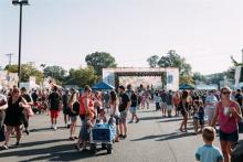 People at an outdoor festival Photo