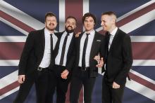 4 Men standing in front of British flag background Photo