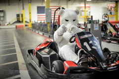 Bunny mascot riding in a go kart