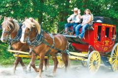 Frontier Town People riding stage coach at Frontier Town
