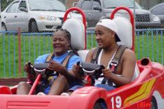 Two people riding in a GoKart