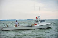 captain and his fishing/crabbing boat
