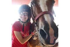 River Valley Ranch Rider with a horse at River Valley Ranch