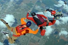 Three people skydiving