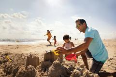 Family playing in the sand in Ocean City