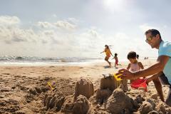 Building Sandcastle on the beach Building Sandcastle