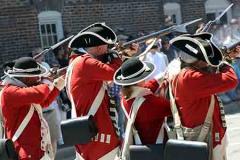 Colonial Re-enactors firing their rifles