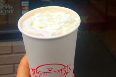 A cup of hot chocolate with whipped cream from Main Roots Coffee