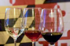 Glasses of wine with the Maryland State Flag behind