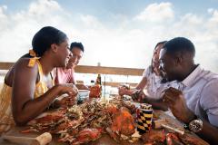 Steamed crabs eating crabs by the water