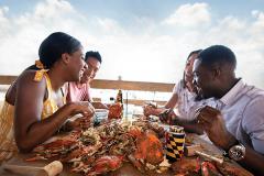 Enjoy crabs by the water eating crabs by the water