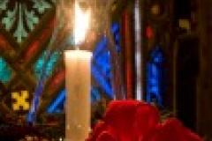 Candle in church window
