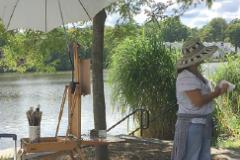 painter by lake