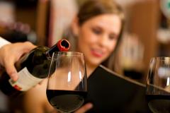woman and bottle of wine
