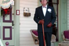 man in suit on porch