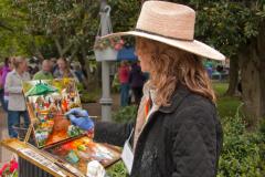woman painting in a park