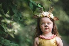 girl wearing woodland creature crown headband
