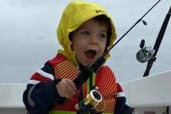 Child in awe over his fishing reel