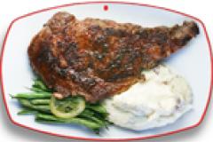 Ribeye steak with mashed potatoes and green beans