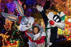 Bugs Bunney and Sylvester the cat with a little girl at Six Flags America's Holiday In The Park