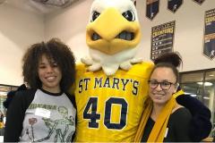 Students posing with mascot