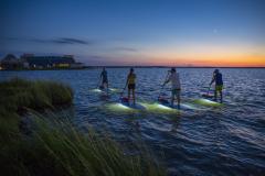 Sunset Standup Paddleboarding Glide along the water with a stand-up paddleboarding session at sunset.