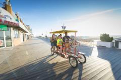Surrey Ride on Ocean City Boardwalk family on pedal surrey on Ocean City Boardwalk