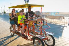 Family riding surrey on OC Boardwalk