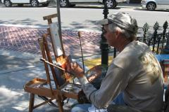 Man painting at a plein air festival