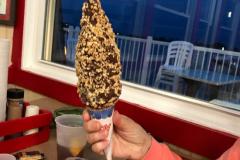 A customer holds up the famous Nutty Buddy Dessert Cone A customer holds up the famous Nutty Buddy Dessert Cone