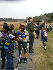 Children students observing during a field trip.