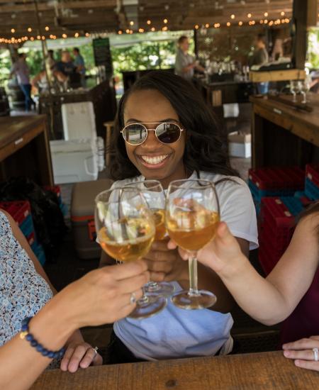 Friend enjoy a toast at Running Hare Vineyard