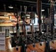 Beer taps at the bar of Waverly Brewing Company Photo