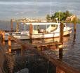 A fishing boat docked at a pier in Tilghman Island Photo