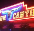 Cancun Cantina sign glows at night. Photo