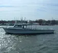 The Charter Boat "Wound Tight" works the mid-bay Photo