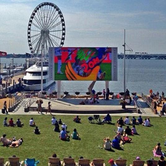 People enjoying an outdoor movie at the National Harbor